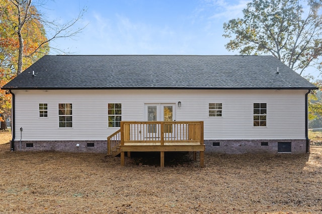 rear view of house featuring a deck