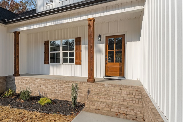 property entrance with covered porch