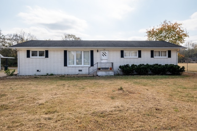 ranch-style house featuring a front lawn