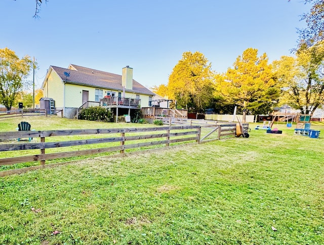 view of yard featuring a wooden deck