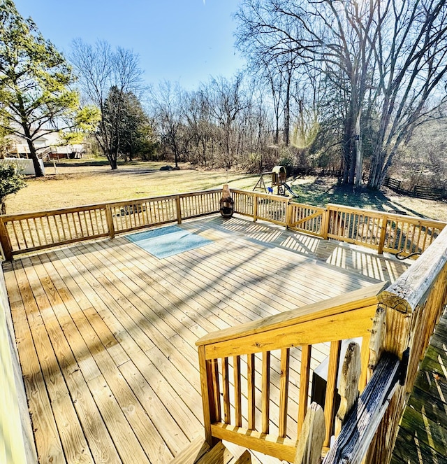 wooden terrace with a lawn