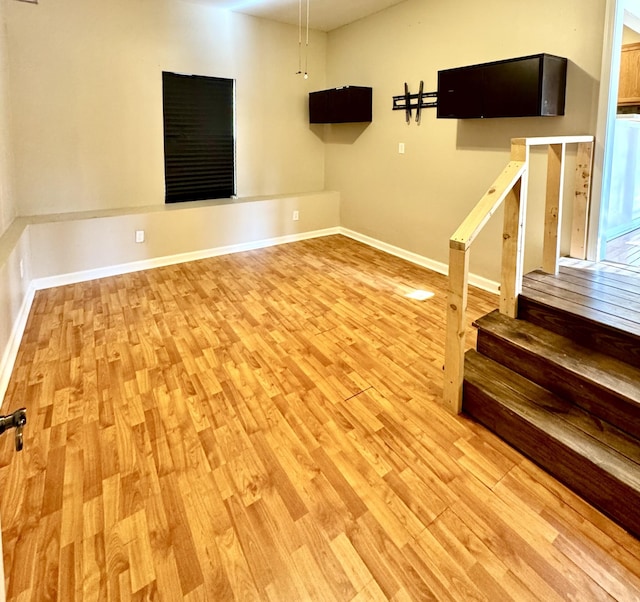 spare room with light hardwood / wood-style floors