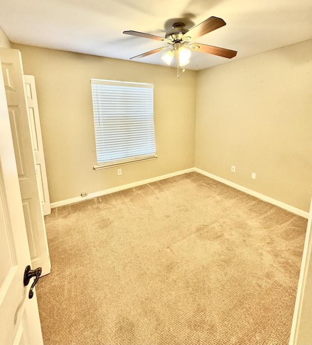 unfurnished room with carpet and ceiling fan