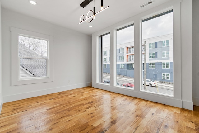 interior space featuring light hardwood / wood-style floors and plenty of natural light