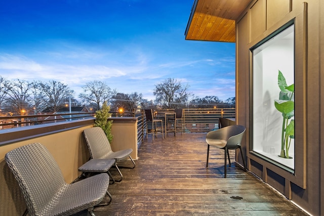 view of balcony at dusk