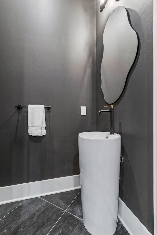 bathroom with tile patterned floors