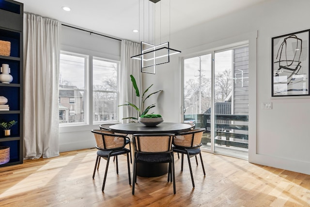 dining space featuring hardwood / wood-style flooring