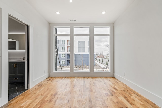 unfurnished room featuring light wood-type flooring