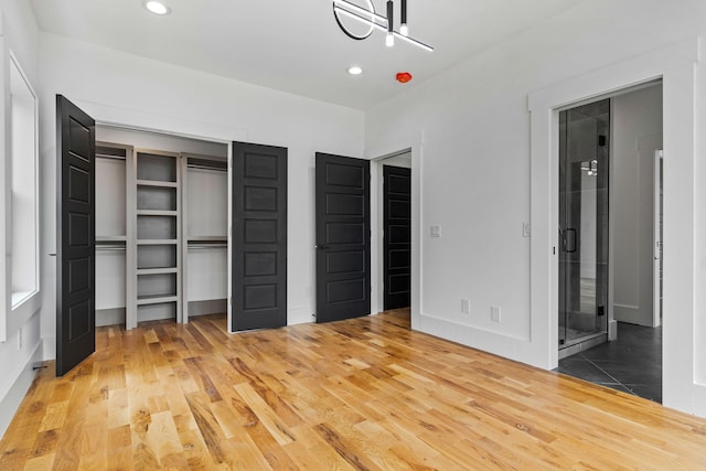 unfurnished bedroom featuring hardwood / wood-style floors