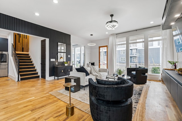 living room with light hardwood / wood-style flooring