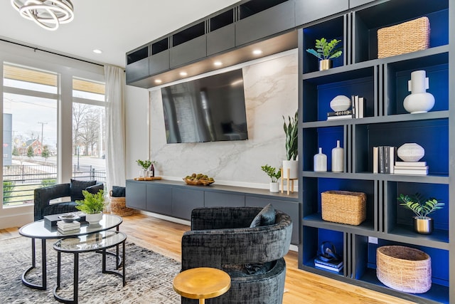 living area featuring hardwood / wood-style flooring and a wealth of natural light