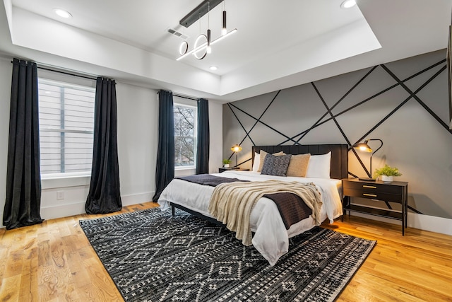 bedroom with hardwood / wood-style flooring