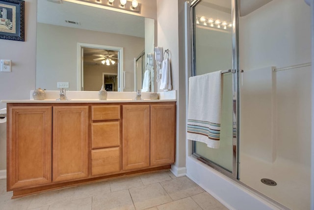 bathroom featuring vanity, bath / shower combo with glass door, ceiling fan, and tile patterned flooring