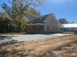 view of home's exterior featuring a porch