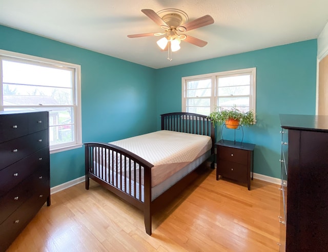 bedroom featuring ceiling fan and light hardwood / wood-style flooring