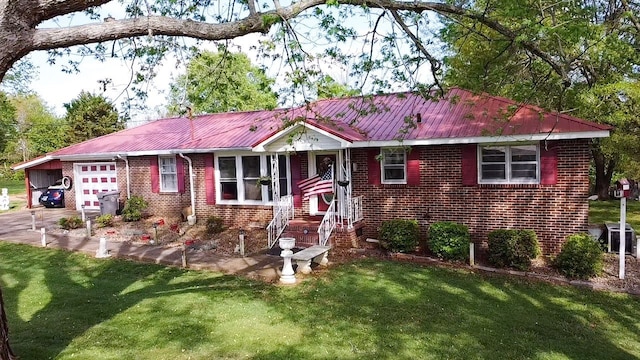 view of front of property with a garage and a front yard