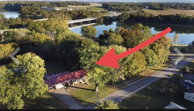 birds eye view of property with a water view