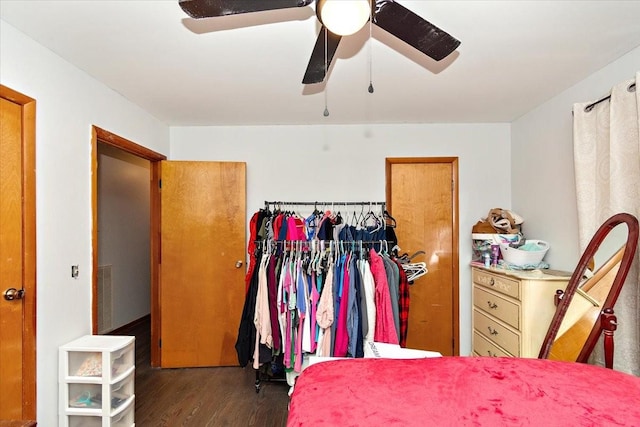 bedroom featuring a closet, dark hardwood / wood-style floors, and ceiling fan