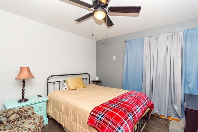 bedroom featuring dark hardwood / wood-style flooring and ceiling fan