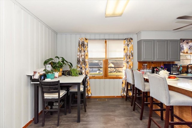 dining space featuring dark wood-type flooring