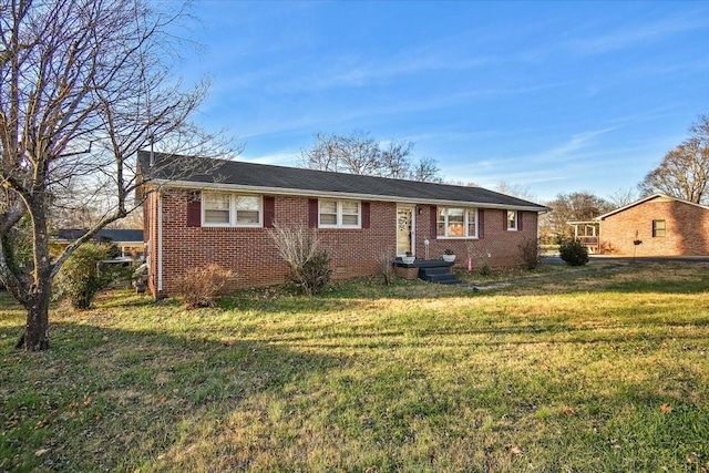 ranch-style home with a front yard