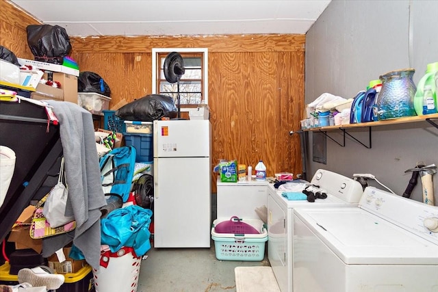 clothes washing area featuring washer and clothes dryer