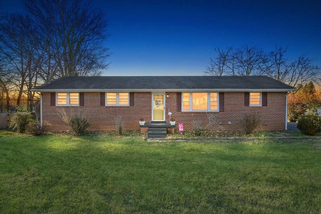 ranch-style house with a lawn