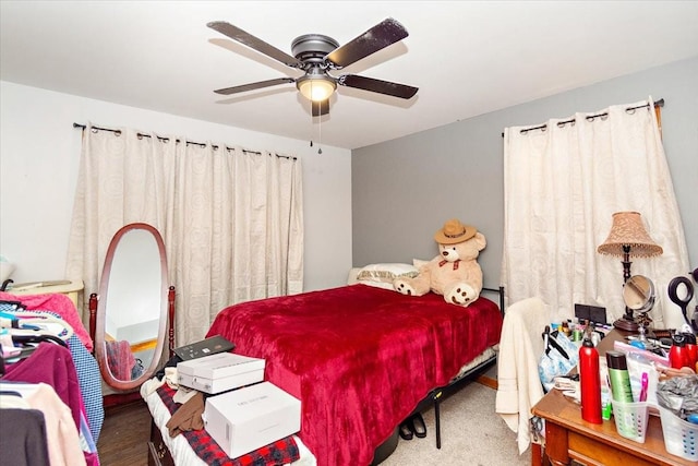 carpeted bedroom featuring ceiling fan