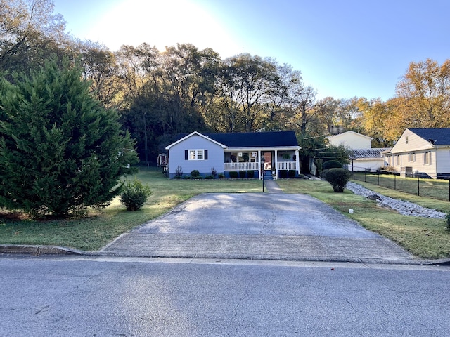 view of front of house with a front yard and a porch