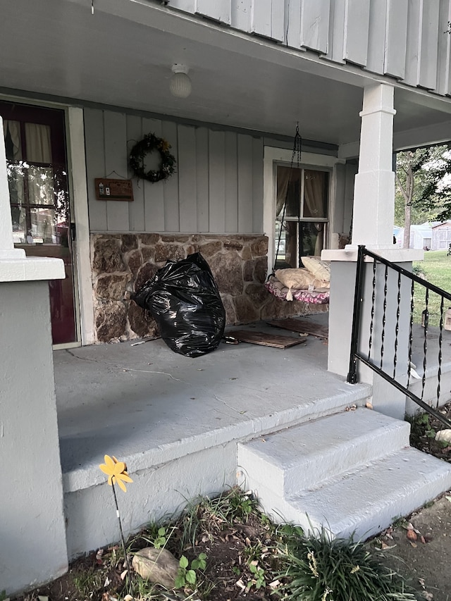 doorway to property featuring covered porch