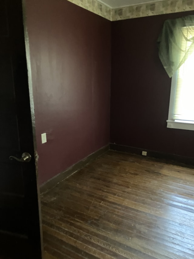 spare room featuring hardwood / wood-style floors