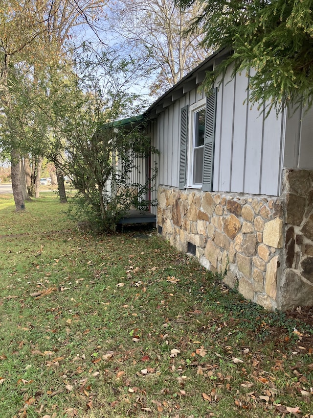 view of home's exterior with a lawn