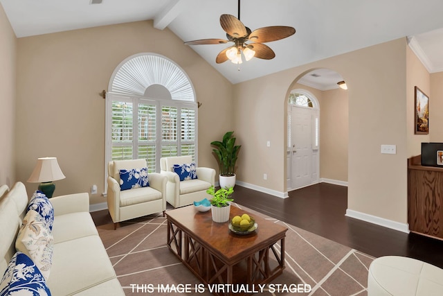 living room with vaulted ceiling with beams, ceiling fan, and dark wood-type flooring