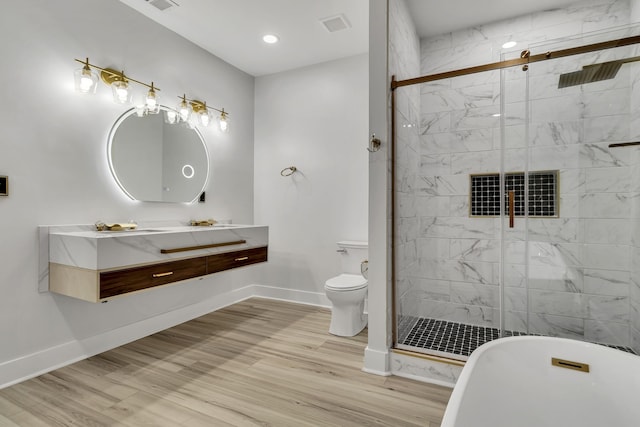 full bathroom featuring toilet, plus walk in shower, hardwood / wood-style flooring, and vanity