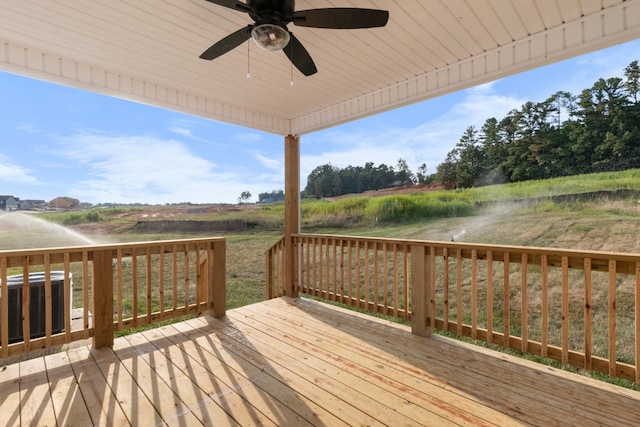 wooden deck featuring ceiling fan and central air condition unit