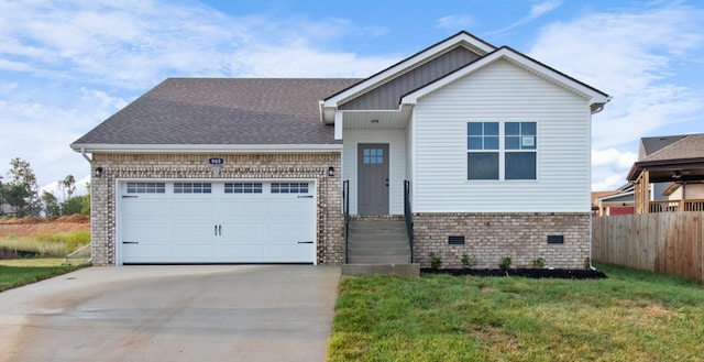 view of front of home featuring a garage and a front lawn