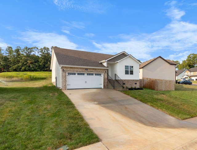 view of front of house featuring a garage and a front yard