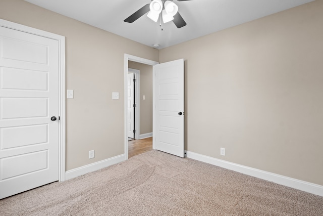 unfurnished bedroom with light carpet and ceiling fan