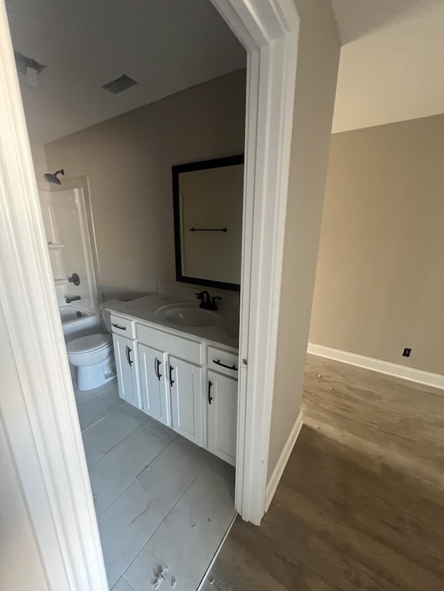 full bathroom with vanity, bathtub / shower combination, and toilet