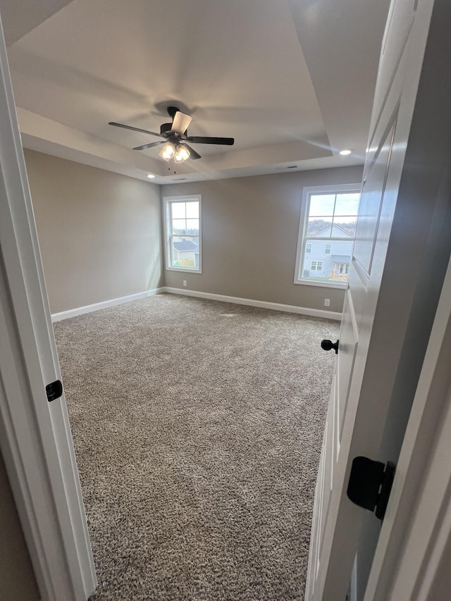 carpeted spare room with ceiling fan, recessed lighting, and baseboards