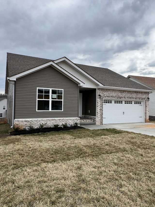 single story home with an attached garage, brick siding, concrete driveway, roof with shingles, and a front yard