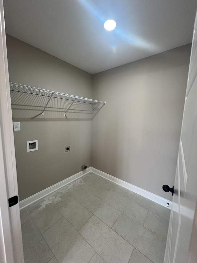 washroom featuring laundry area, hookup for a washing machine, baseboards, and hookup for an electric dryer