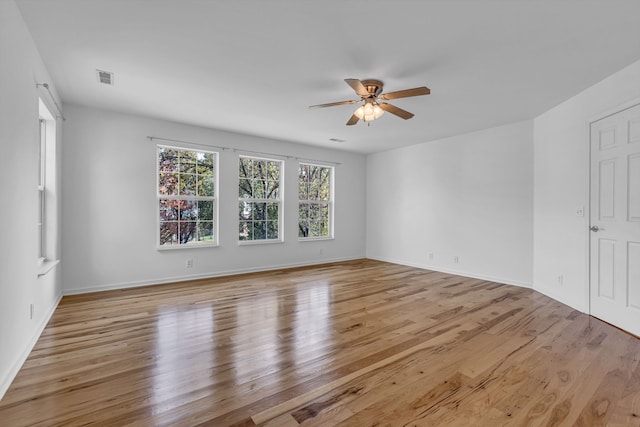 unfurnished room featuring light hardwood / wood-style flooring and ceiling fan