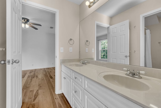 bathroom featuring vanity, ceiling fan, and hardwood / wood-style floors