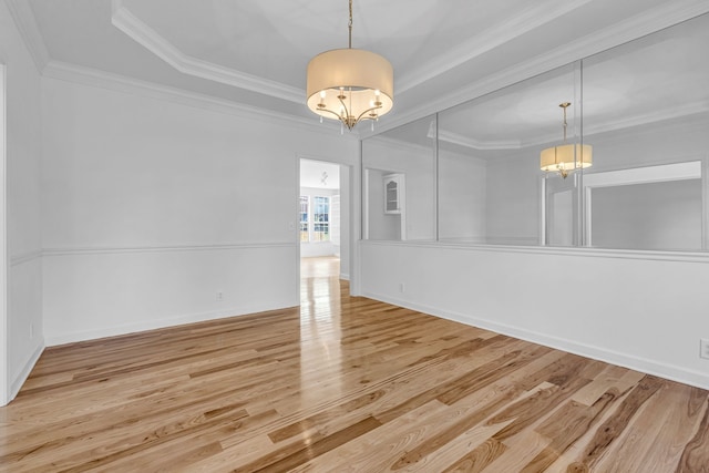 unfurnished dining area with light hardwood / wood-style flooring and crown molding