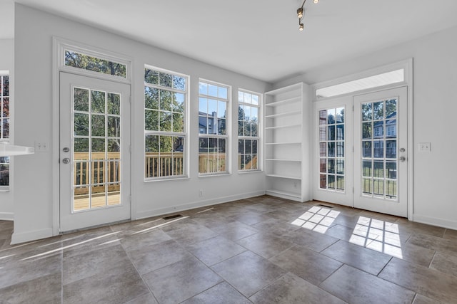 view of unfurnished sunroom