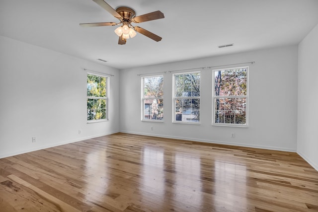 unfurnished room with light hardwood / wood-style floors and ceiling fan