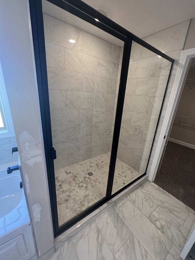 bathroom featuring an enclosed shower