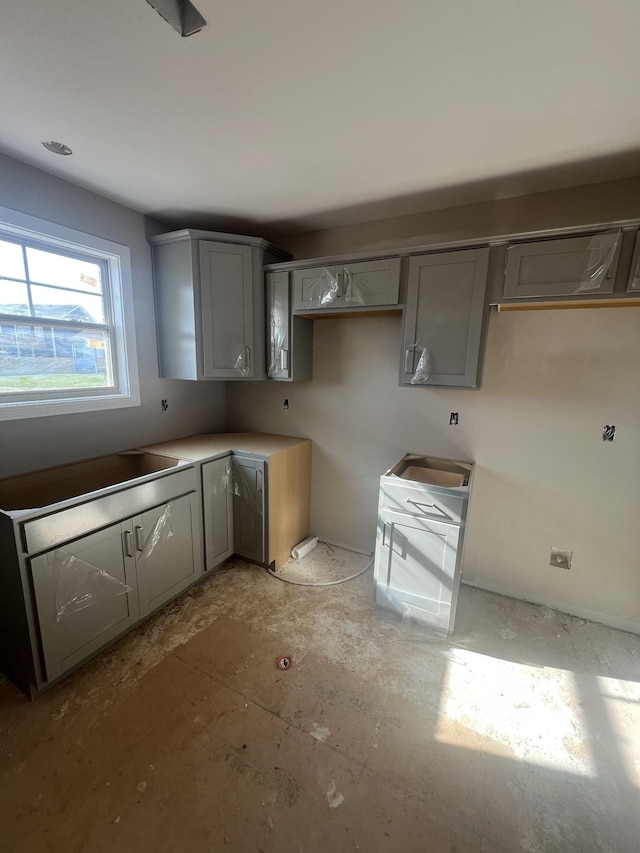 kitchen featuring gray cabinetry and sink