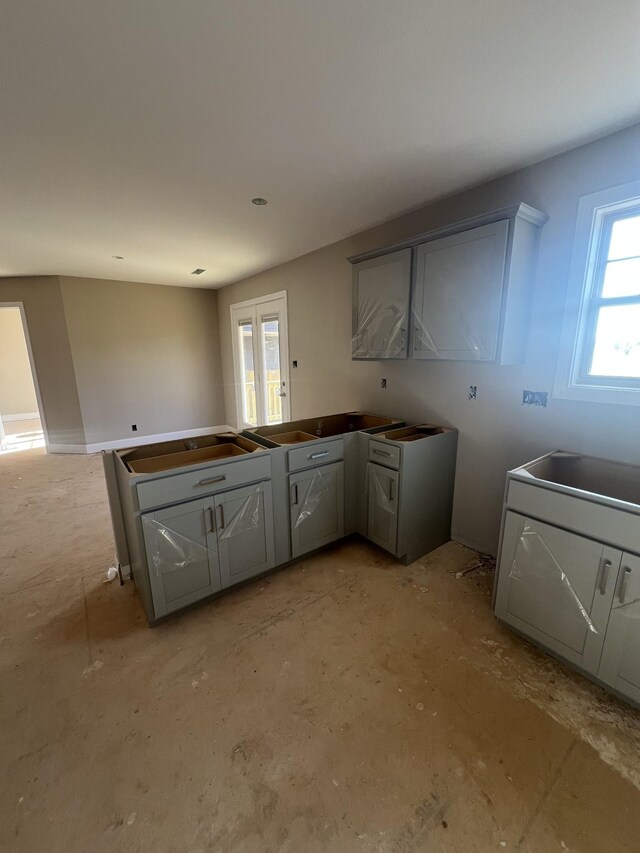 kitchen with gray cabinets and sink